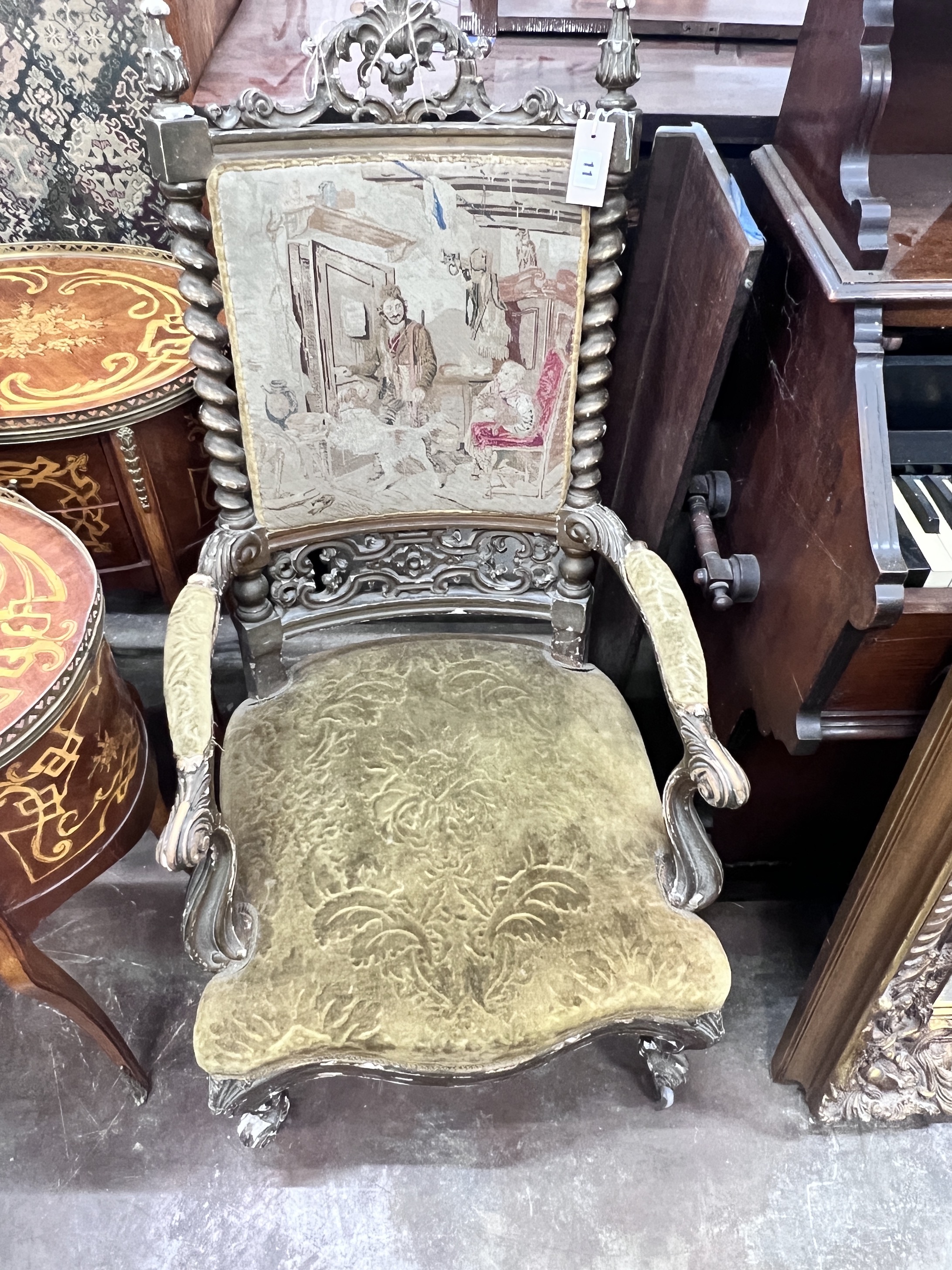 A Victorian carved giltwood and composition tapestry back open armchair, width 54cm, depth 56cm, height 108cm